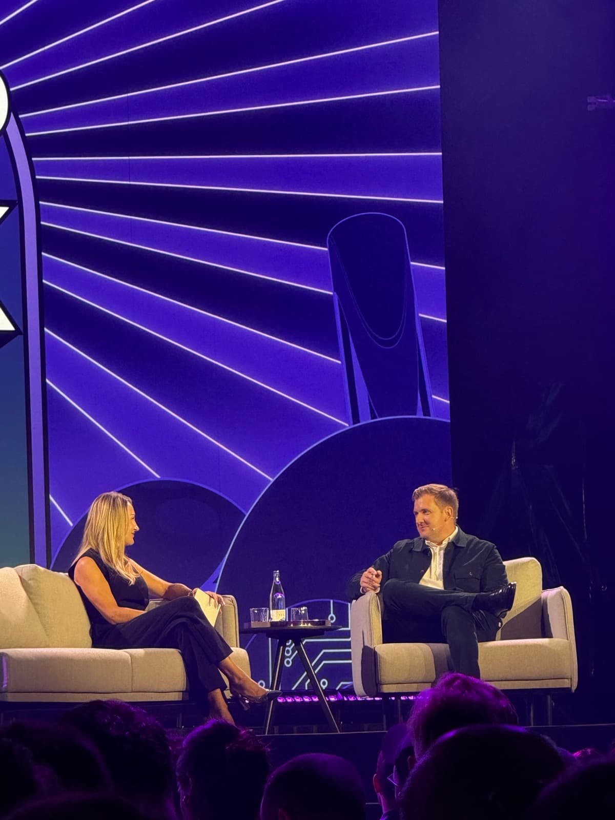 Two speakers in a fireside chat on the main Shoptalk stage