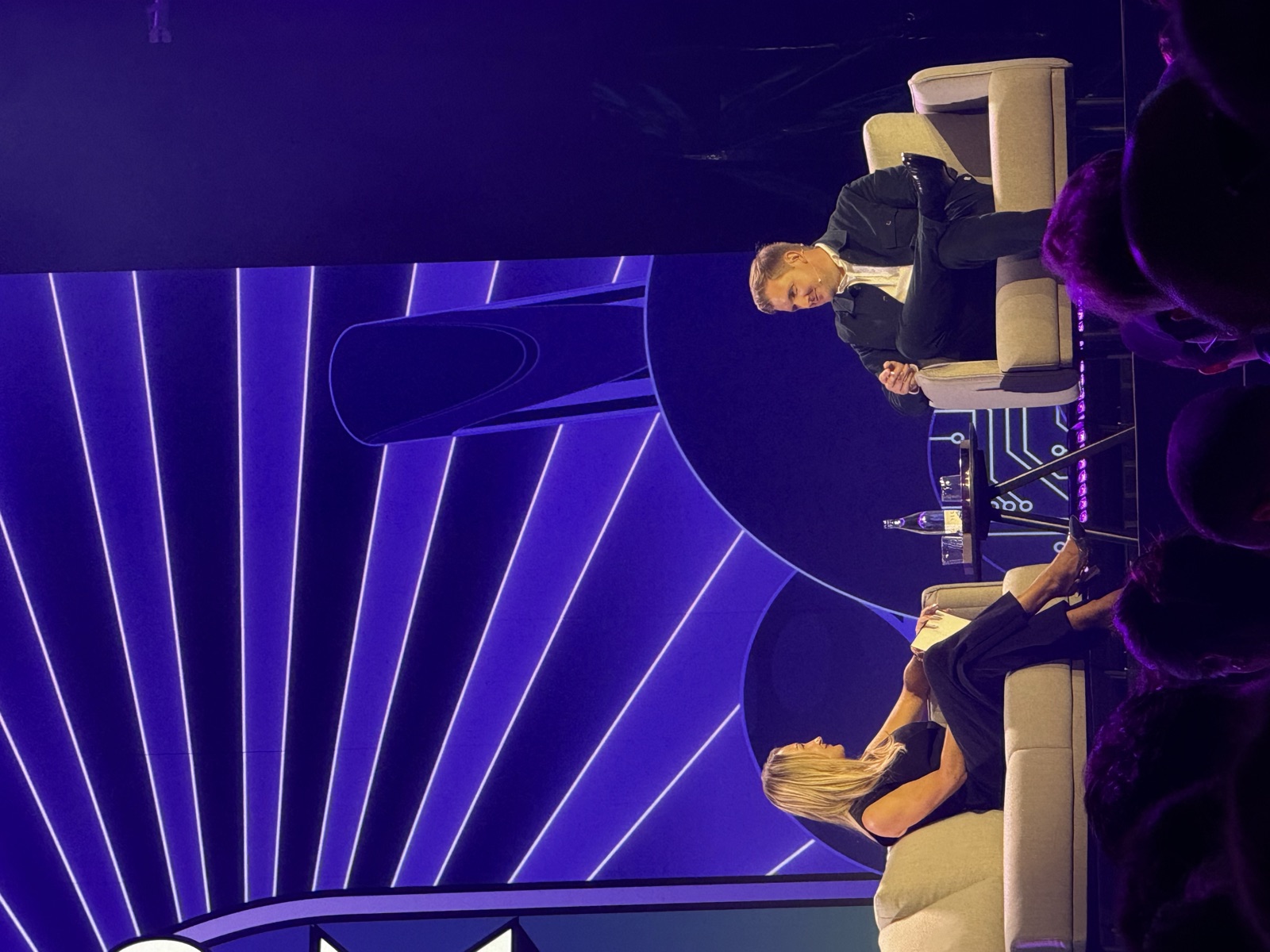 Two speakers in a fireside chat on the main Shoptalk stage